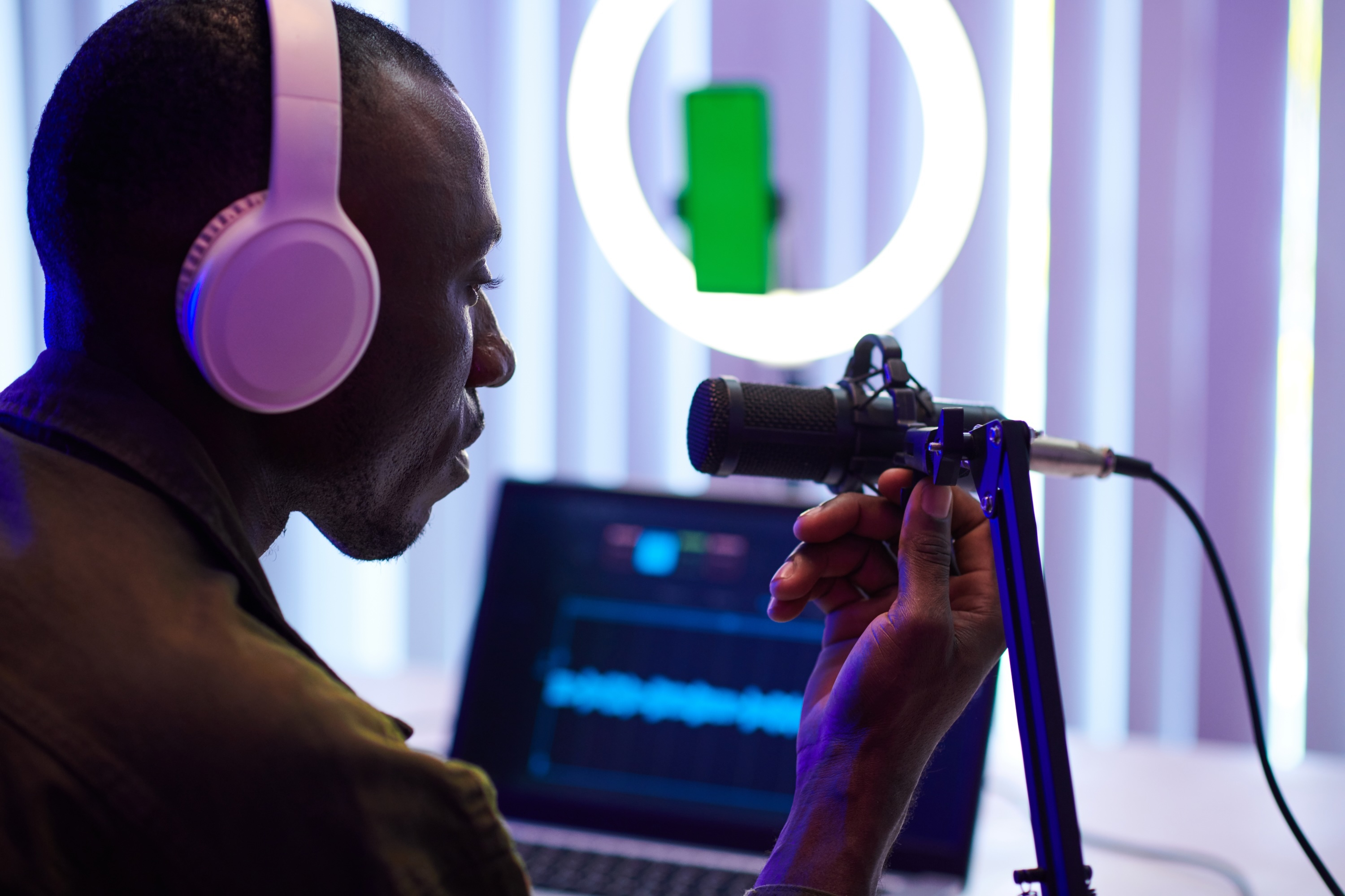 Man setting up podcast recording