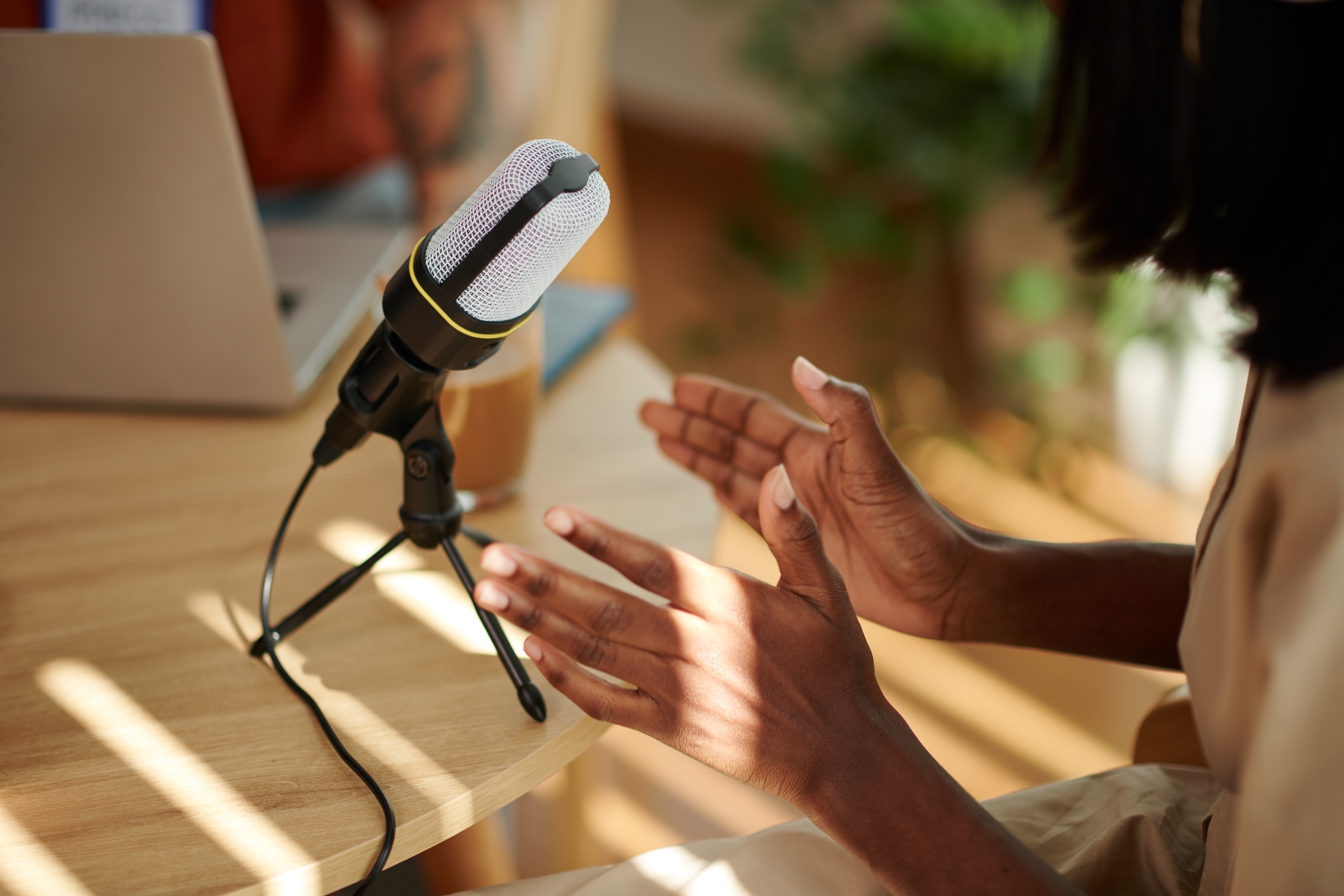 Podcast guest speaking into microphone