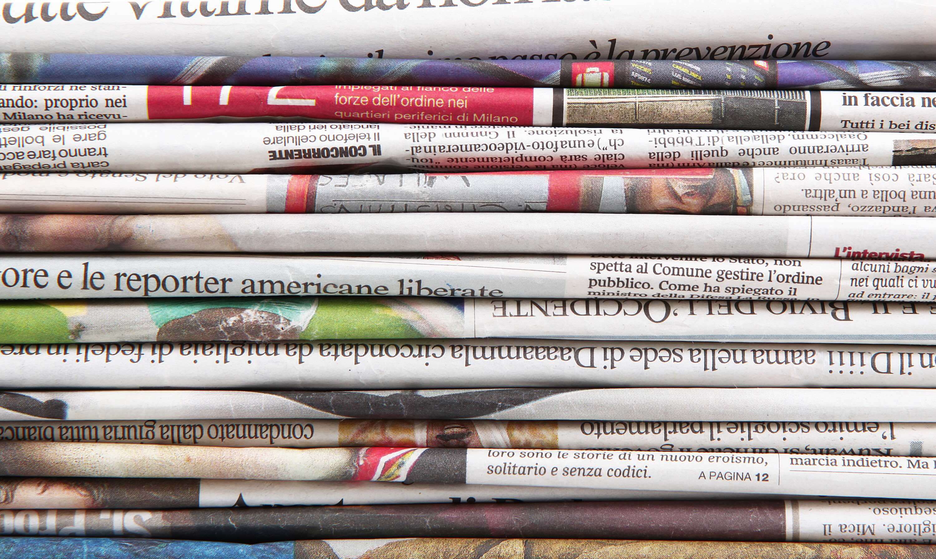 Newspapers folded and stacked into a pile